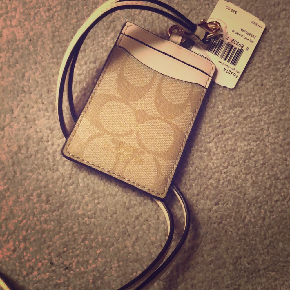 Tan Coach badge holder